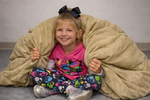 Ball_Blanket_girl_Wrappedaround_shoulders-1_1536_1024 Child wrapped in sensory ball blanket for calming comfort