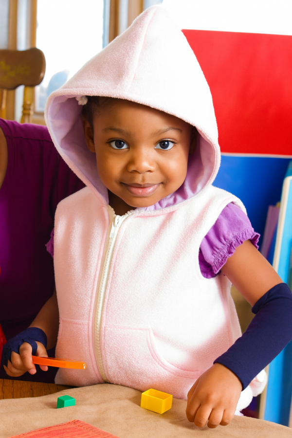 Girl Vest looking at camera